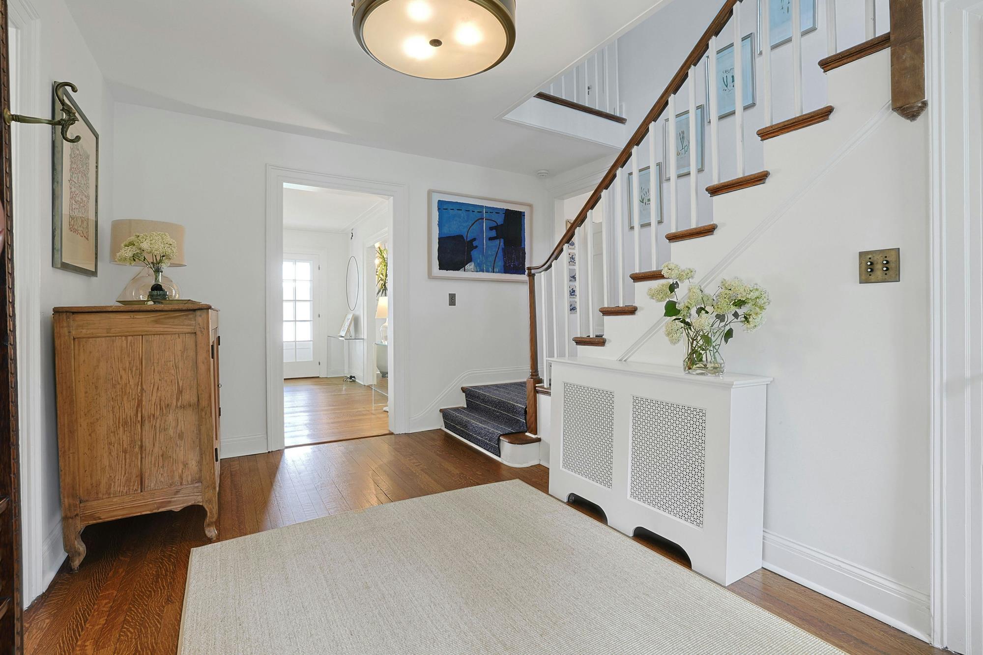 Butler's pantry with an 11-foot soapstone counter and custom glass-fronted cabinetry.