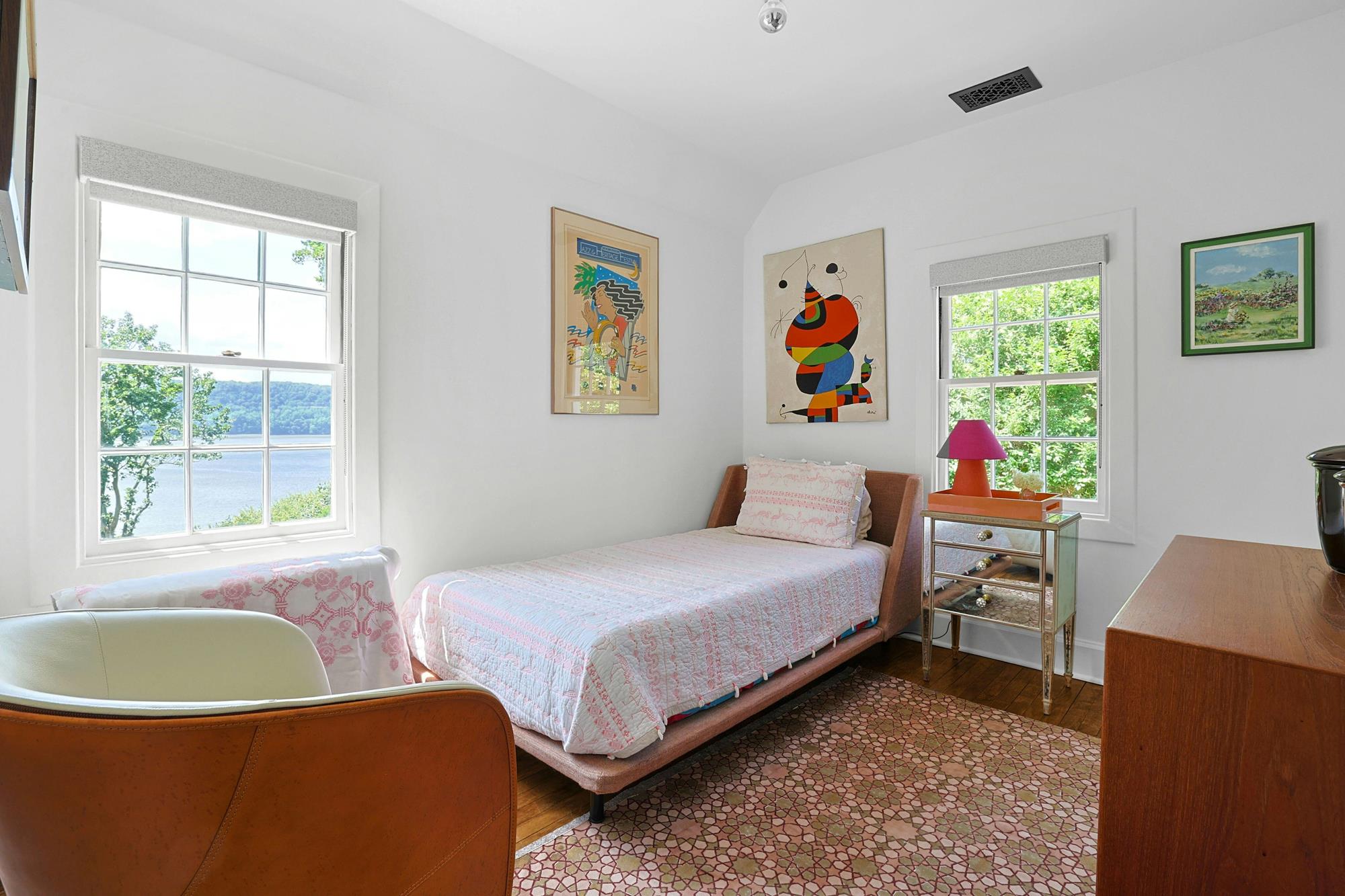 Front entry with antique carved hat-rack mirror and views through to adjoining rooms.